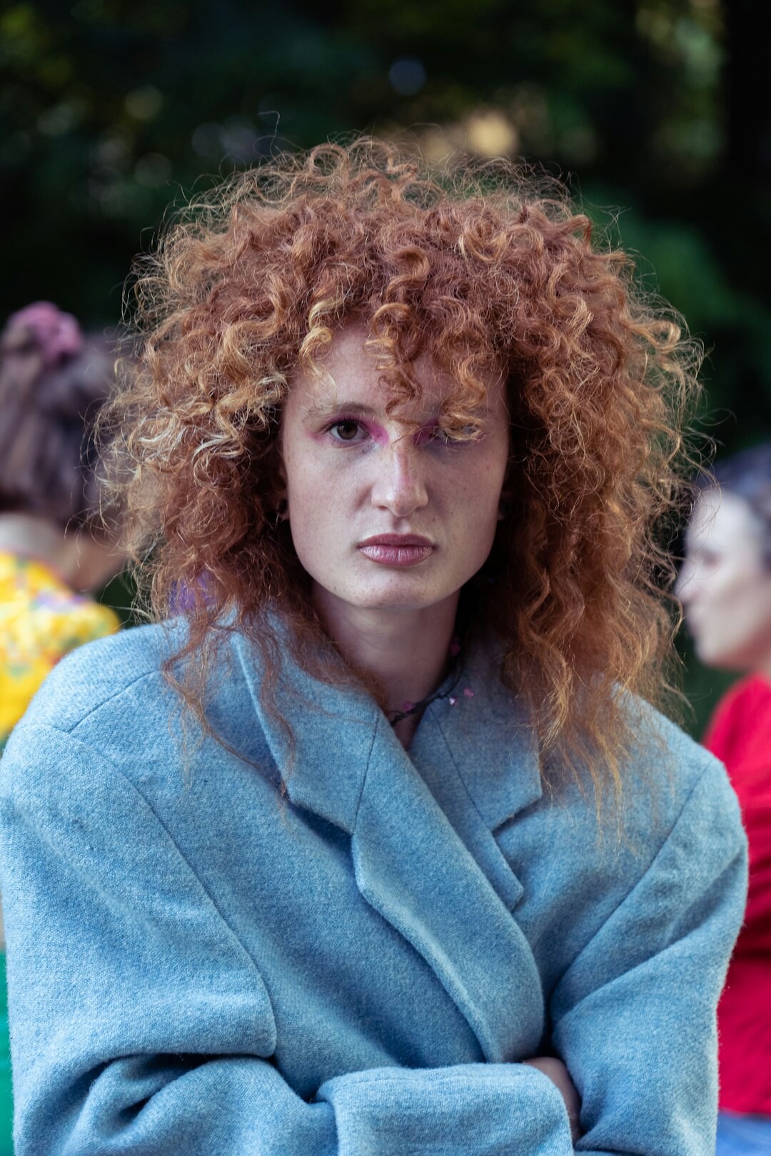 Portrait of a European woman moderator with curly hair